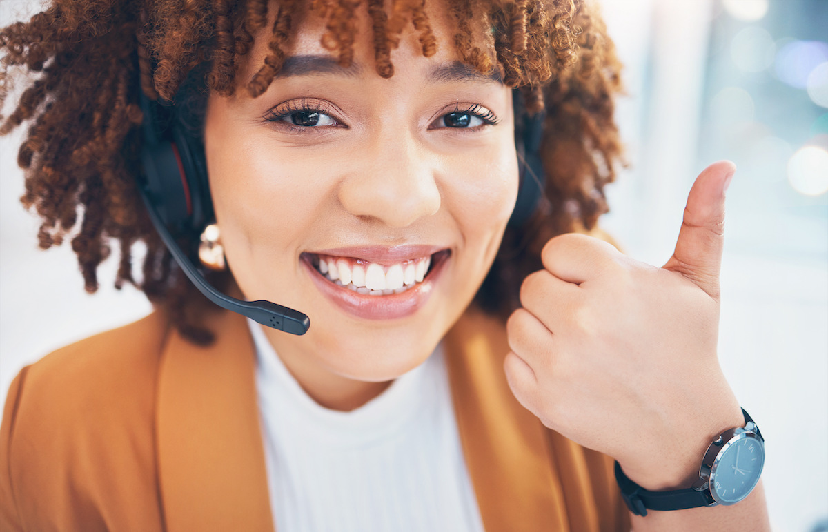 black-woman-portrait-and-thumbs-up-in-call-center